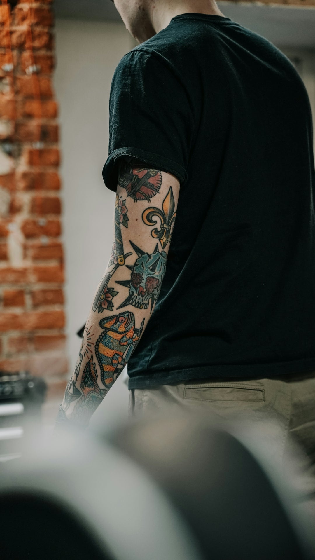 a man with a tattoo on his arm