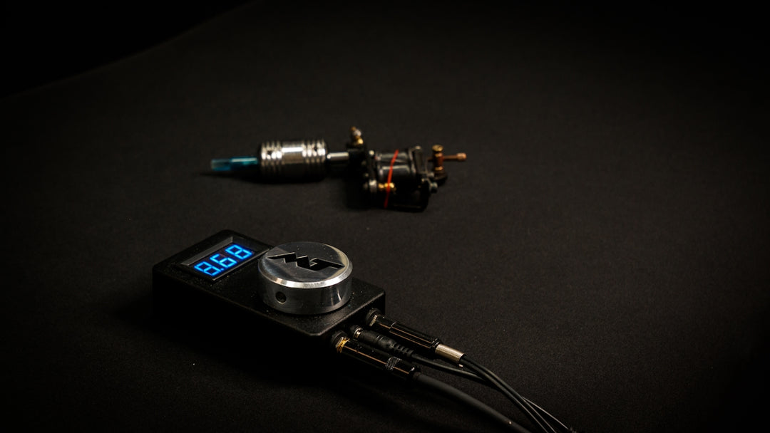 Tattoo machine and power supply on black surface